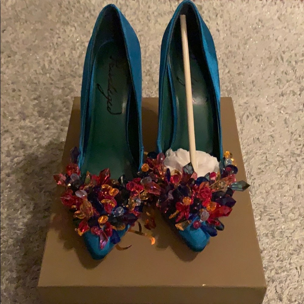 Teal colored pumps